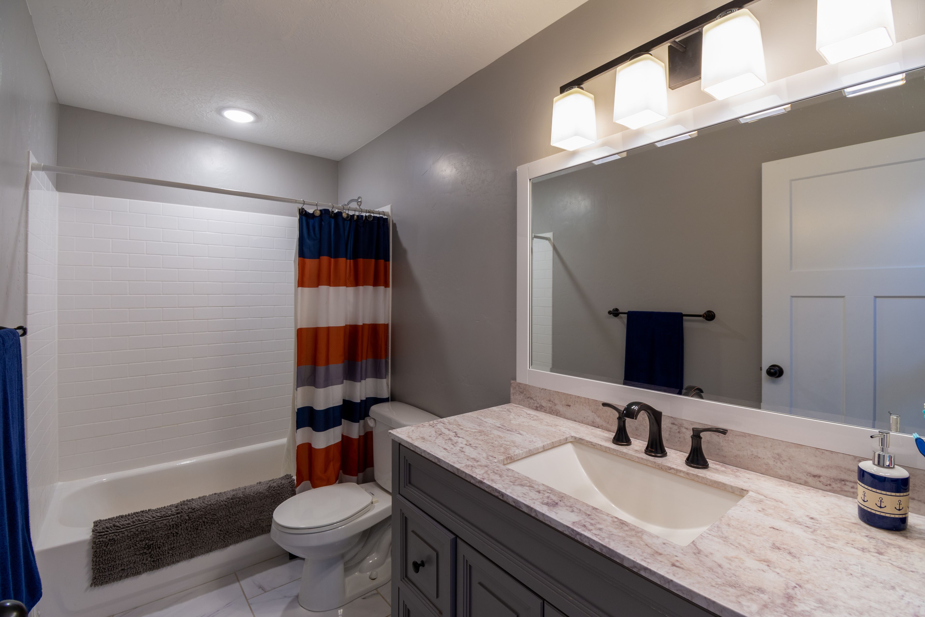 <AI>IMG: Generate an image for service "Badkamer- en sanitairinstallaties" to be used as a background image has a great contrast to white text (don't include text).</AI>